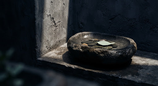 Smooth stone basin in a quiet, sunlit room